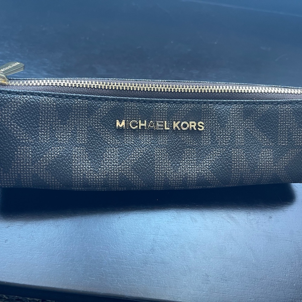 Micheal Kors pencil/pen or makeup holder zipper case.